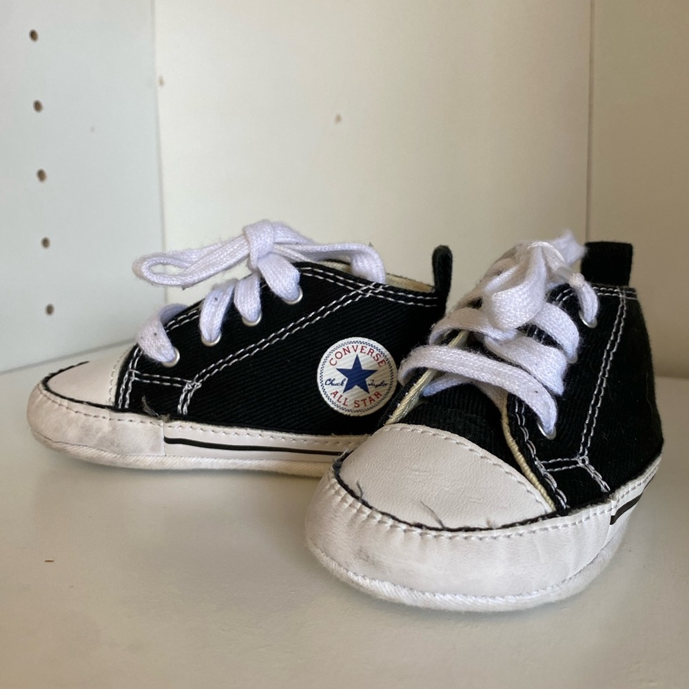 Converse crib shoes. Lightly used. Bottom of the shoes shows the most wear.